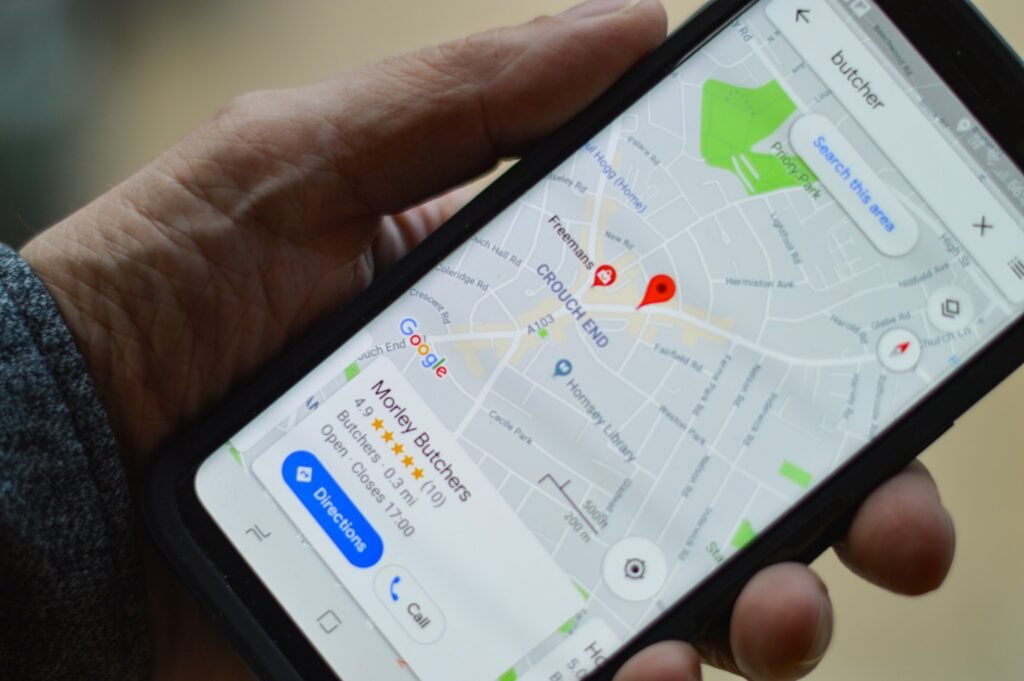 hand holding onto mobile app Google maps